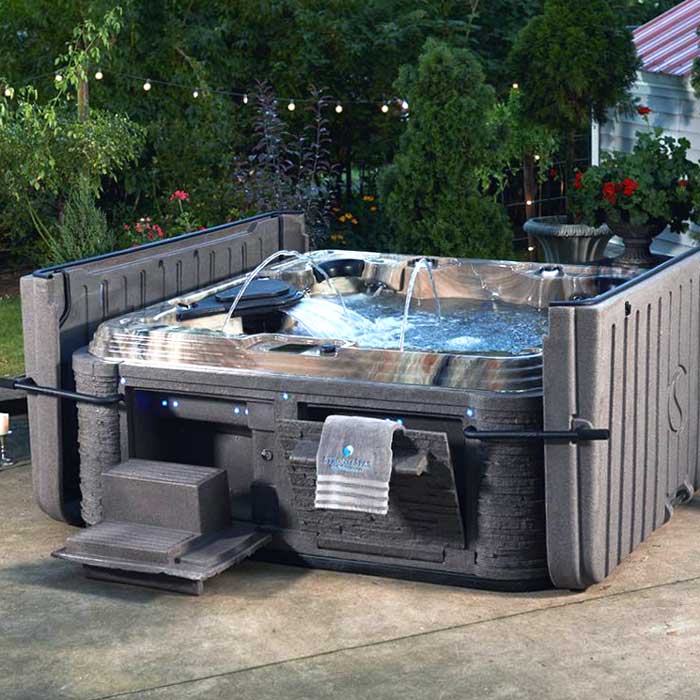 A professional fixes a hot tub leak